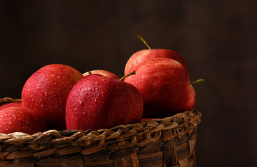 A basket filled with fresh picked Gala Apples.