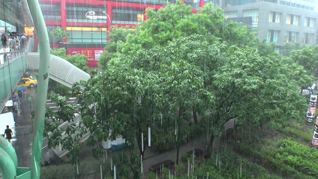 TAIPEI, TAIWAN - AUGUST 2019 : Very strong heavy rain in typhoon season. Scenery around Xinyi shopping district. Rainy season concept video.