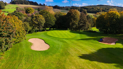 Drone view of autumn golf course in Germany.