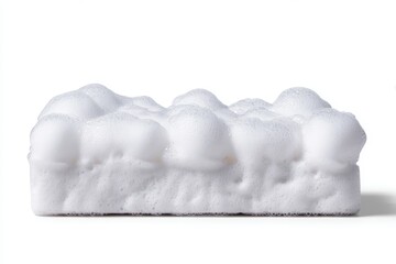 Close-up of soapy foam on a white sponge against clean background.