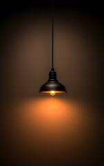 Obraz premium Pendant light: illuminated, classic style, vintage. Suspended from a dark cord, casting a warm glow on the brown wall beneath it.