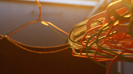Colorful Plastic Hangers Illuminated by Warm Sunlight