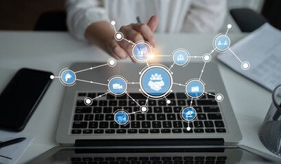A close-up of a modern laptop keyboard with a digital handshake graphic, symbolizing partnership and collaborative efforts in a connected business environment. Tessel