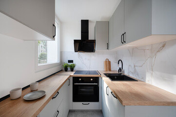 Small modern kitchen in an apartment building.	