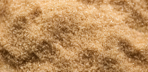 Brown Cane sugar background close up. Brown sugar backdrop, texture. Heathy eating, diet concept....