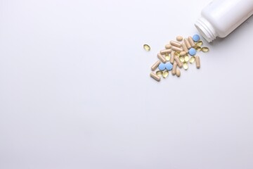 Vitamins pills and injectable in a white background