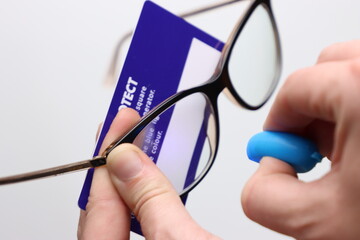 UV filter protection in a glass lens confirmed by a blue led light and a white card
