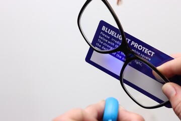 UV filter protection in a glass lens confirmed by a blue led light and a white card