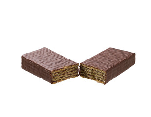 Sweet chocolate wafer broken into two pieces isolated on white background.
