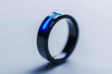 Close up macro of smart wearable biometric ring sensor detecting oxygen levels with glowing LED.
