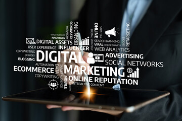 A professional in a business suit holds a tablet showcasing various terms associated with digital marketing, highlighting the importance of branding, online presence, and strategies. Tessel