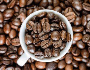 Coffee beans in cup, roasted espresso grains, aromatic food photography background