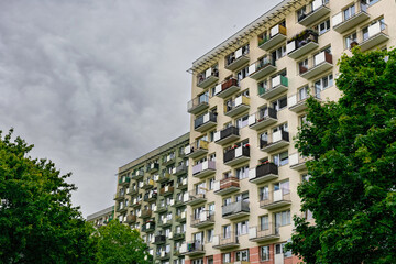 Old obsolete block building with yellow balconies. Soviet architecture in Europe	