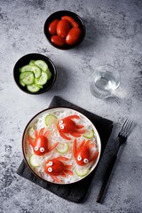 Rice noodles funchose with fresh tomatoes in the form of fishes in a bowl