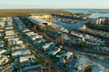 Destroyed by hurricane strong winds suburban houses in Florida mobile home residential area. Consequences of natural disaster