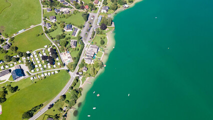 Wolfgangsee in Salzkammergut on a sunny summer day, aerial drone view. Wolfgangsee im Salzkammergut...