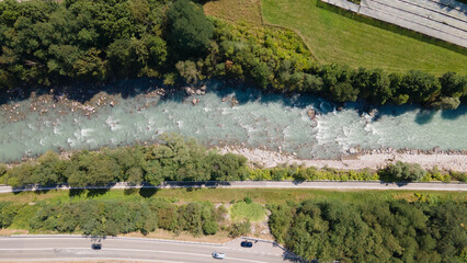 Scenic road on the north side of Italy. Bonita escena de carretera con rio y montañas en Italia....