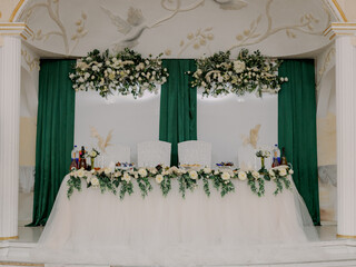 Wedding table with food and drinks in the banquet hall.