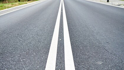 Asphalt Roadway with Central White Lines under Bright Sunlight
