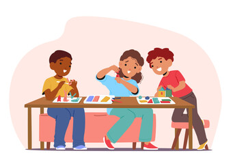 Excited overjoyed preschool children playing with clay plasticine creating different figures