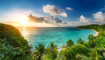 Fototapeta premium Serene Tropical Paradise With Lush Greenery And Sparkling Turquoise Water At Sunset