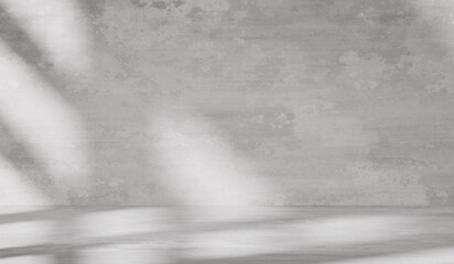 Gray background with cement wall texture. Minimalist abstract background for product presentations with soft shadows from the window