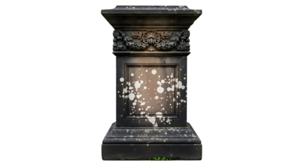 A weathered, dark stone pedestal with ornate carvings and lichen spots, isolated on transparent background