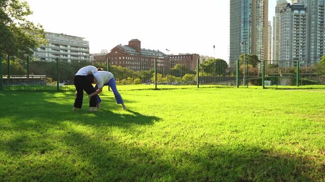 Young athletes mastering Jiu Jitsu outdoors.