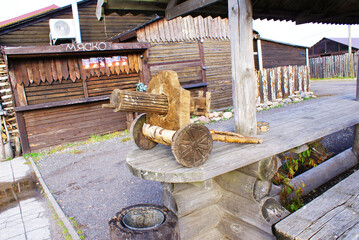 Wooden machine gun, wood texture, log house, background, wooden planks, design.