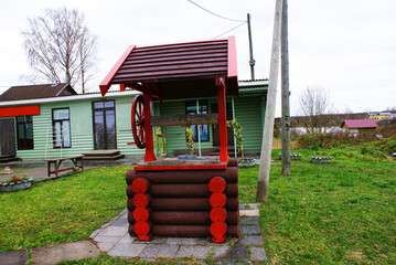 Wooden well, wood texture, log house, background, wooden planks, design.