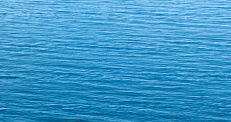 Blue calm sea as texture background for web banner template page design