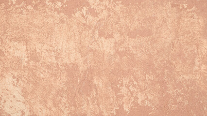 Fototapeta premium Beige wall with rough texture. It is covered with many small dots. Beige textured background.
