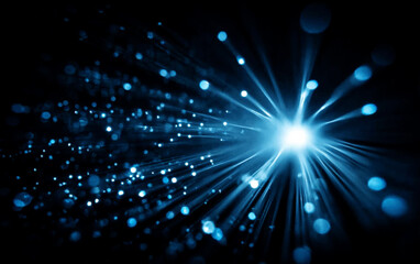 Bright Blue Light Burst with Radiating Lines in Dark Background