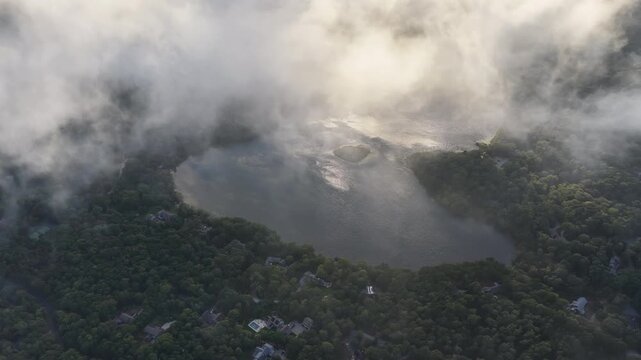 Low clouds drift above Pilgrim Lake in Orleans on Cape Cod. This scenic Massachusetts peninsula harbors many ponds and lakes left over from the last glacial period.