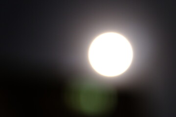 A pure white full moon in the dark night sky. Photos of the full moon after the Blood Moon eclipse. Supermoon, blood moon, celestial events. Astrology, planets, zodiac signs. Istanbul - Turkey.