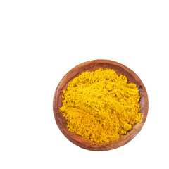 Organic curry yellow powder in the wooden bowl - Healthy food