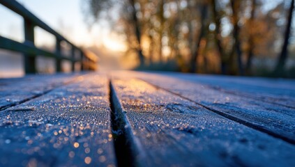 Frosty wooden bridge at sunrise