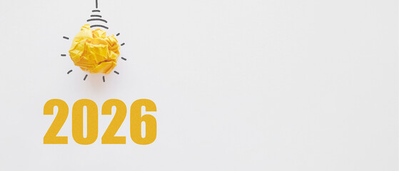 2023 with Yellow paper light bulb, innovative business vision and resolution concept