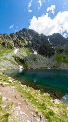 Mountain lake scene under a partly cloudy sky (1)
