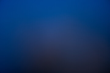 A stunning photo of a lunar eclipse with the moon glowing at night above the sea, creating a dramatic celestial seascape.