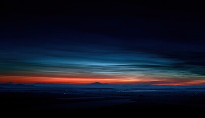 A breathtaking panoramic view of a misty sunrise over a landscape