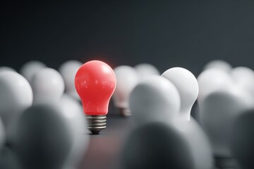 A single red light bulb stands out amongst many white ones