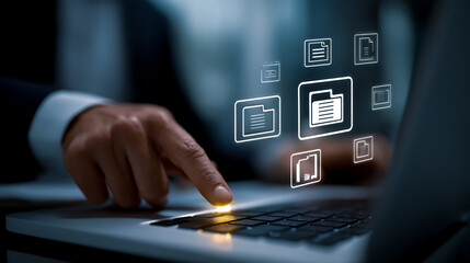 A businessman using a laptop computer to work with digital documents, a document management system concept.