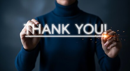Person writing thank you message with glowing neon text and sparks gratitude appreciation