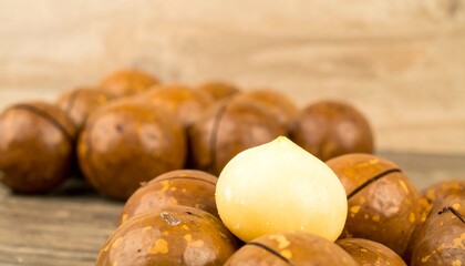 Macadamia nuts on a wooden surface
