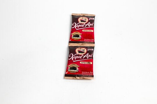 Indonesia, Sukoharjo - June 19, 2025 : black coffee sachets brand steamer (Kapal Api) product from Indonesia, isolated on white background