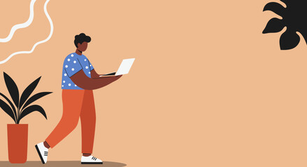 Young man working on a laptop while walking, illustrating remote productivity, digital connectivity, and flexible modern work lifestyle.