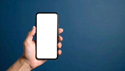 スマートフォンを持つ手。ネイビー背景。紺色。Hand holding a smartphone. Navy background. Dark blue.