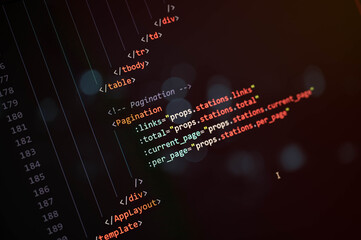 Close-up view of modern HTML and JavaScript source code with pagination function on dark screen, representing web development, frontend programming, and digital software engineering.