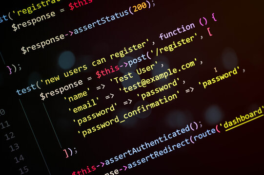 Close-up of PHP code testing new user registration with password confirmation and redirect to dashboard, representing backend programming, software testing, and secure authentication system.